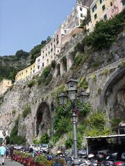 Scenic view of Amalfi coast with town built into hillside and Mediterranean Sea