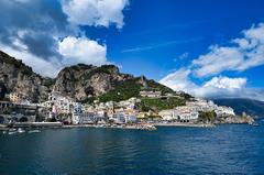 Panoramic view of Amalfi coast with historic town and lush mountains