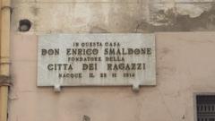 Stone plaque indicating the home of Don Enrico Smaldone