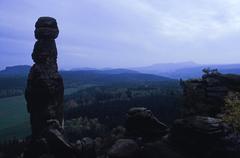 The rock needle Barbarine at Pfaffenstein in Saxon Switzerland with the table mountain Papststein in the background