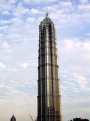 The Jin Mao Tower in 2005 with a crane starting construction of the SWFC in the background