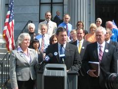 Congressman Gerlach speaking with Montgomery County Commissioners at a petition event to stop the relocation of the Barnes Museum