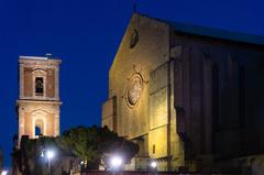 Belltower and façade of Santa Chiara, Naples in the evening