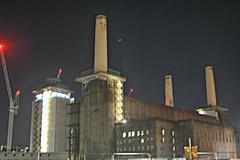 Battersea Power Station at night with one chimney missing during reconstruction