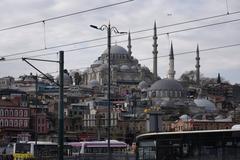 Galata Bridge over the Golden Horn in Istanbul with people walking and fishing