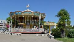 traditional merry-go-round with stairs and closed cash-cabin in Royan