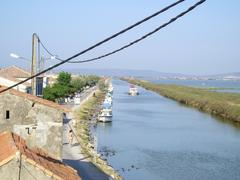 Rhône to Sète canal at Cabanes de Carnon in Palavas-les-Flots with Pérols pond and Villeneuve-lès-Maguelone in the background