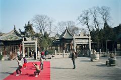 Children practice martial arts under teacher's supervision in Xi'an Great Mosque