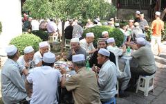 Communal eating at the Great Mosque in Xi'an, Shaanxi province, China, August 2014