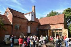 Open day at Sarehole Mill with visitors enjoying the outdoor event next to the historic building