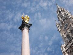 A close-up view of Mary's statue and the city hall at Marienplatz