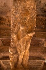 statue in Badami Cave Temples appearing as a servant girl from one angle and a monkey from another