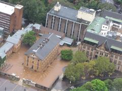 View of Hyde Park Barracks and The Department of Lands building in Sydney on a grey day