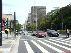 A busy street scene of Avenida Paulista in São Paulo with skyscrapers and cars