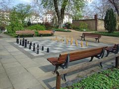 Bethmannpark in Frankfurt with people playing chess near the Friedberger Landstrasse entrance