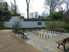 People playing chess at the entrance of Bethmannpark in Frankfurt