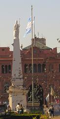 Piramide de Mayo surrounded by pigeons in Buenos Aires