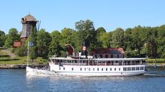 Archipelago boat passing Waldemarsudde oil mill in Djurgården