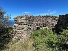 Castell de Verdera on a hilltop with clear blue sky