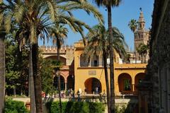 Aerial view of Seville with the Guadalquivir River winding through the city.