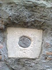 BRONZINO image showing water supply mouths on a lateral wall of Porta in Via Ravecca