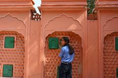 A girl looking out of a window at Hawa Mahal