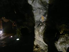 Smocza Jama cave entrance with stone dragon sculpture in Krakow