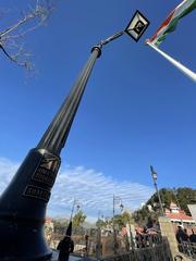 flag, lamp post and skies at The Ridge in Shimla