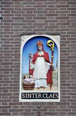 17th-century Dutch gable stone depicting Sinterklaas reviving three children in a tub