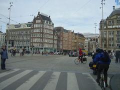 Dam Square in Amsterdam with national monument and surrounding buildings