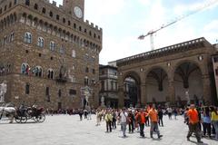 panoramic view of Florence, Italy, showcasing historic buildings and the Arno River