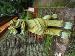 Statue at the base of Wat Lok Moli chedi