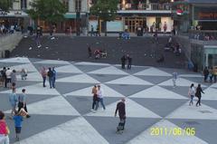 People strolling at Sergels Torg on a warm Monday evening, Sweden's National Day