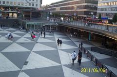 People strolling in Sergels Torg on a warm Monday evening, Sweden's National Day