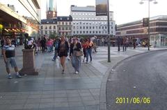 people strolling at Sergels Torg on a very warm Monday evening, Sweden's National Day