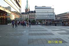 People strolling at Sergels Torg on a very warm Monday evening, Sweden's National Day