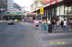 Pedestrians at Sergels Torg on a warm Monday evening, Sweden's National Day