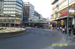 People strolling at Sergels Torg on a very warm Monday evening, Sweden's National Day