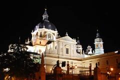 Aerial view of Madrid with prominent landmarks including the Royal Palace and Almudena Cathedral