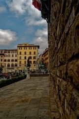 View of Piazza della Signoria in Florence, featuring Judith and Holofernes statue, Neptune Fountain, and Cosimo I on horseback