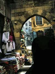 Khan El Khalili Bazaar with traditional Muslim woman