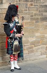 Edinburgh's Royal Mile in Scotland with people walking along the historic street