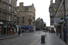 Edinburgh cityscape with historic buildings and hilly landscape