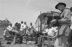 Police talking with residents at the Stenen Hoofd trailer camp in Amsterdam during a proposed eviction in 1989