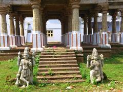archaeological site entrance with statues of gods