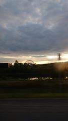 Biosphere glistening in the sunlight surrounded by modern buildings at sunset in Montreal