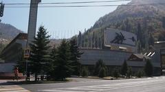 Kazakhstan daytime cityscape with modern buildings and mountains in the background