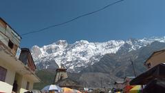 Kedarnath temple with snow-capped mountains in the background