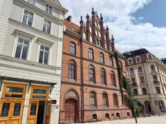 Wrocław pl. Wolności with Max Born Forum, religious services building, and Hotel Monopol