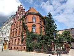 Wrocław street with a school building in the background